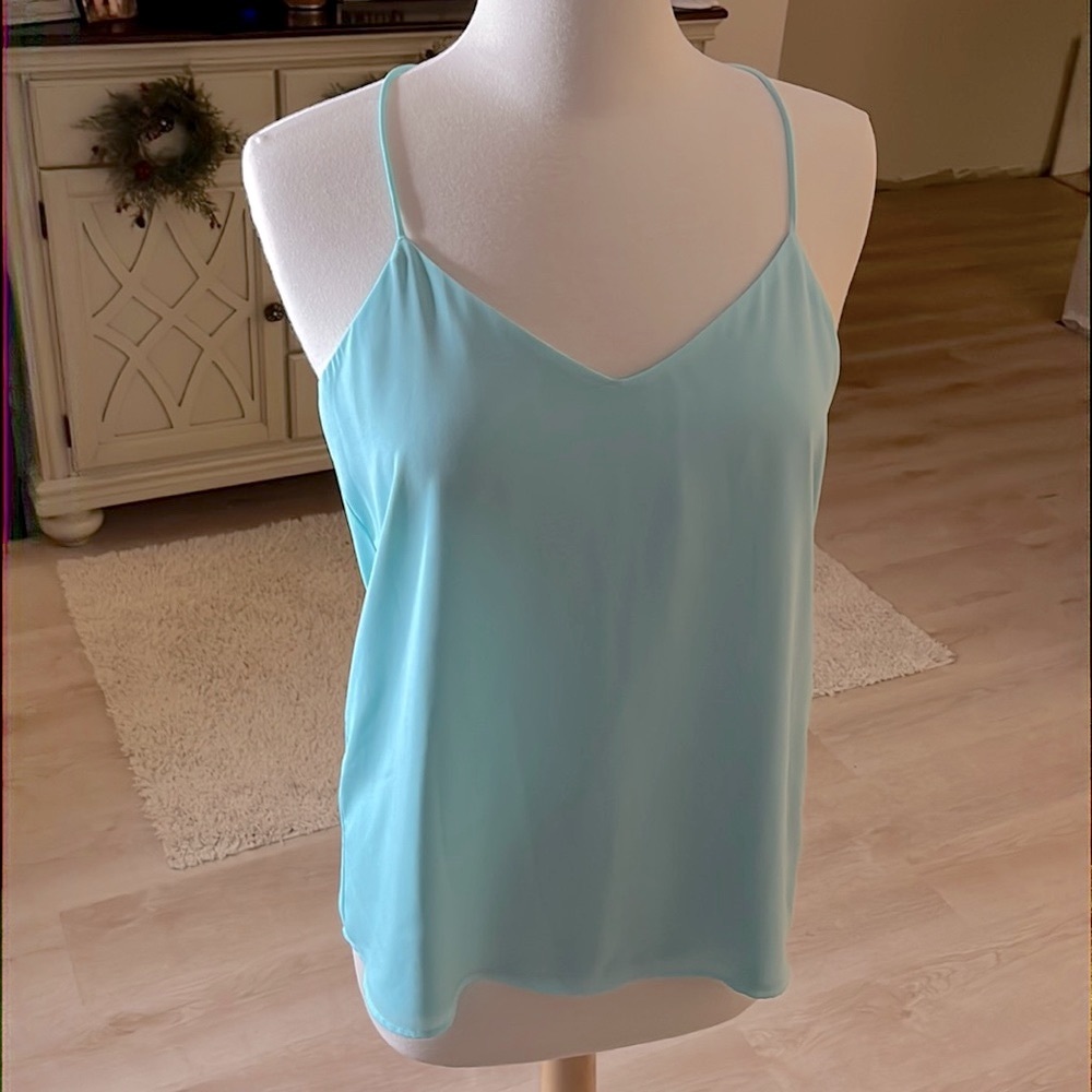 REVERSIBLE Express tank blouse. Turquoises. Medium. Never worn. Excellent cond.